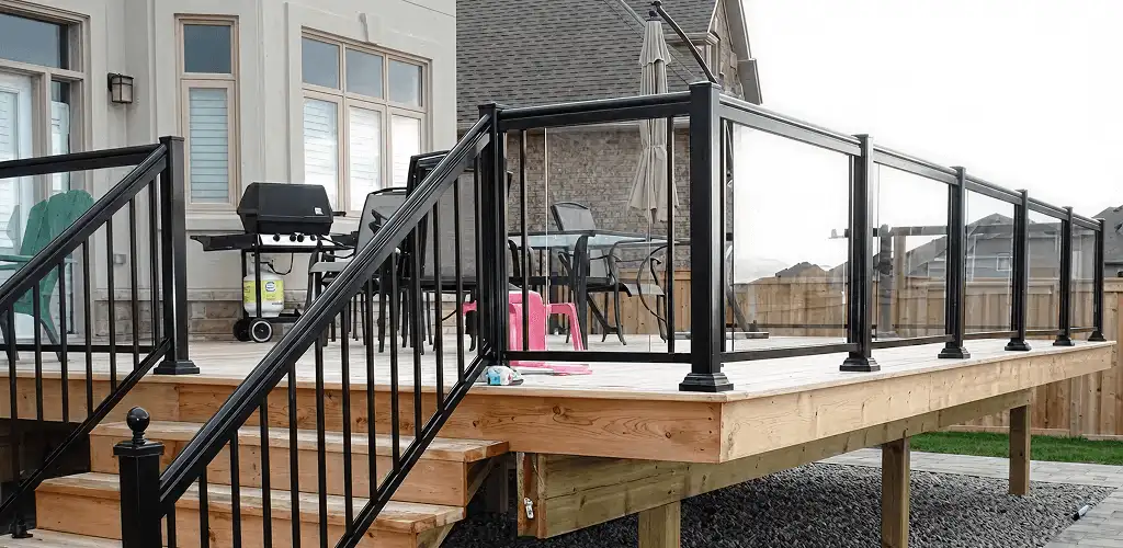 Handrail installation on a deck staircase for safety and code compliance in Lowell, MA