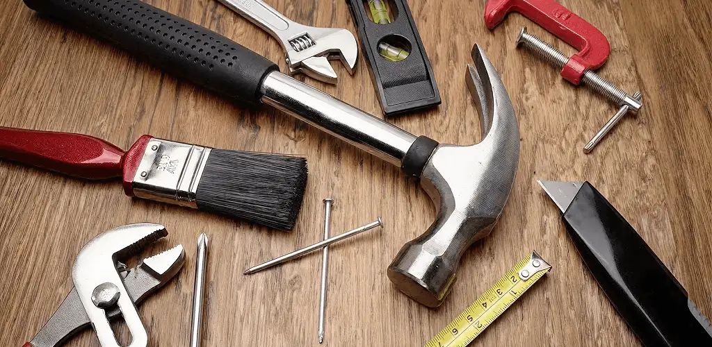 Handyman tools laid out for home repair and maintenance work in Lowell, MA