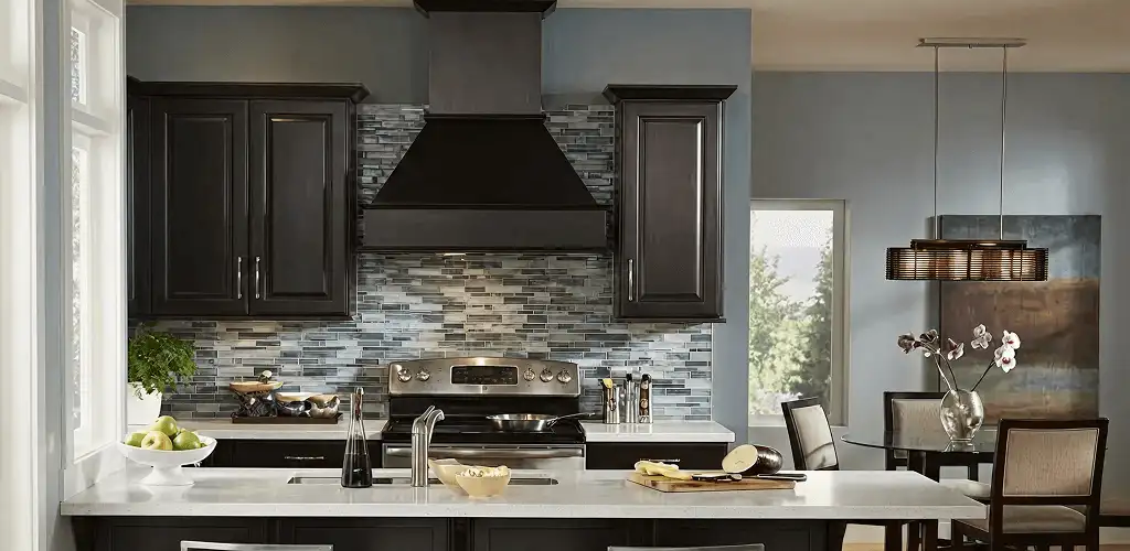 Kitchen cabinet painting and refinishing in a modern kitchen in Lowell, MA